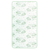 A white and green baby blanket showcasing a charming cloud motif.